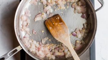 onion and garlic sauted in a skillet