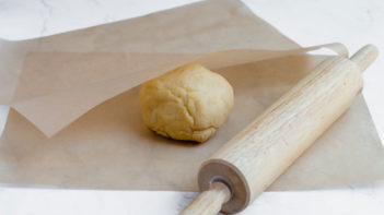 roll the ball between parchment paper