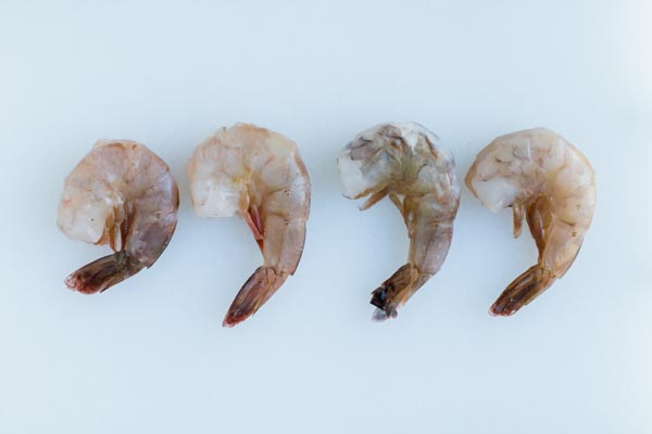 raw shrimp on a cutting board