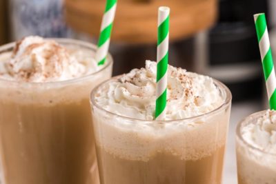 three frappuccinos with whip and straws