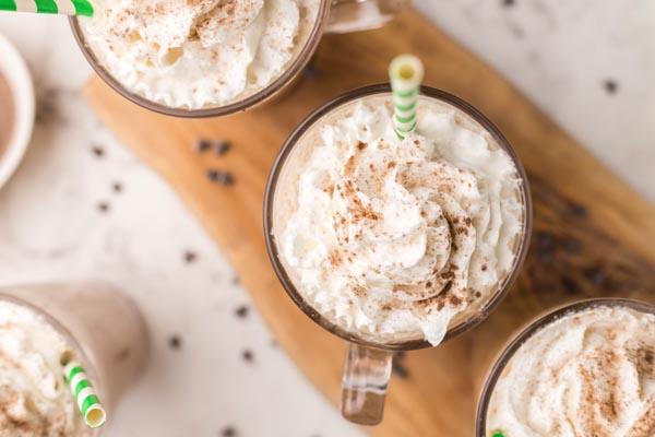 looking down on a whipped cream and cocoa topped frappe