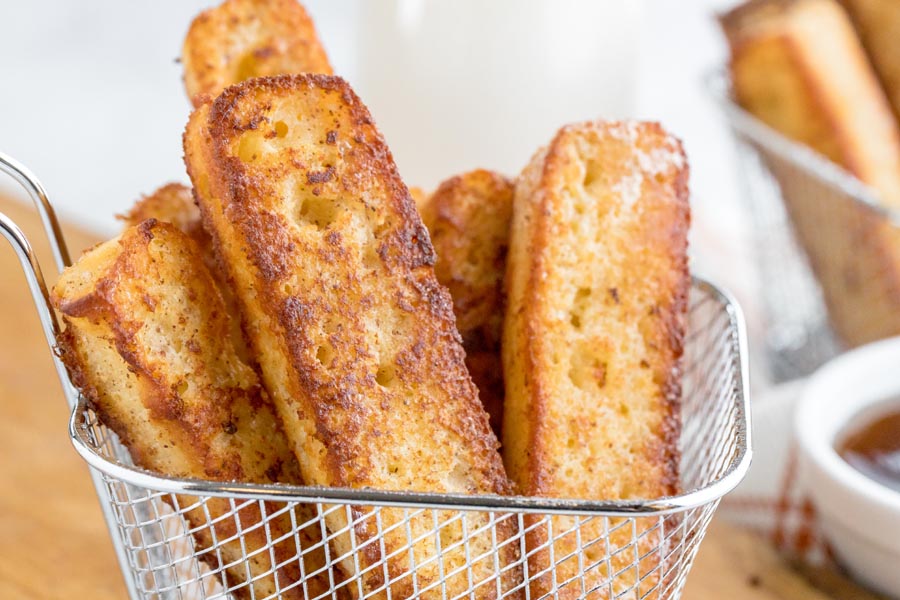 crunchy french toast sticks in a small fry basket