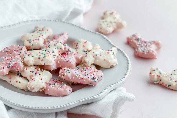 plate of keto frosted animal cookies with three animals leaving the tribe