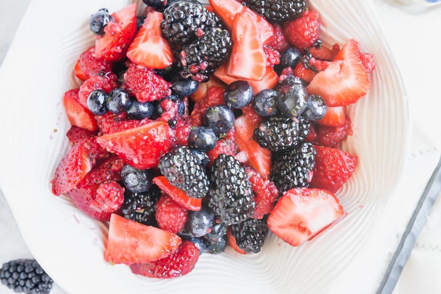 a berry fruit salad with blueberries, strawberries and blackberries