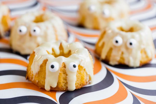 four mini cakes that look like ghosts
