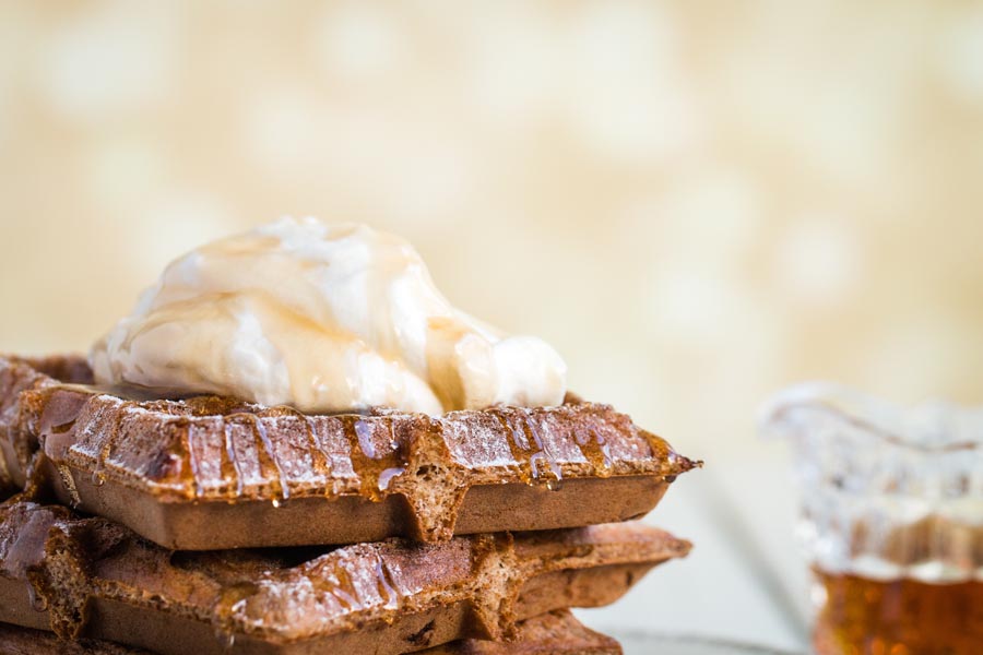 close up of keto gingerbread chaffle topped with whipped cream