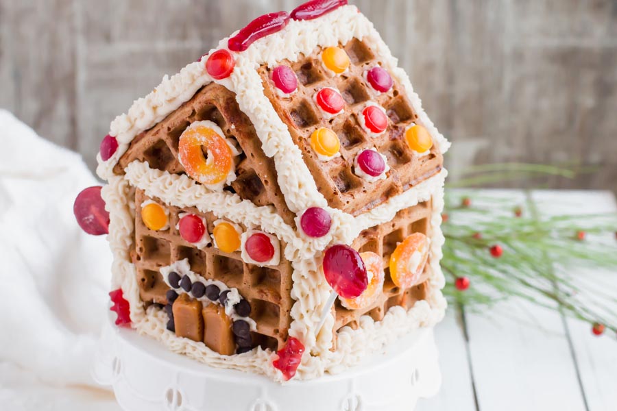 keto gingerbread house on a stand