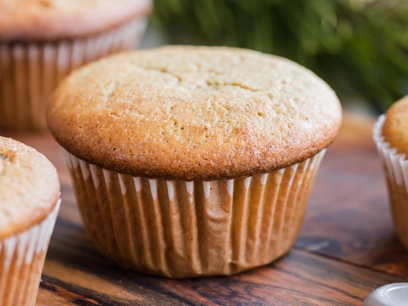 a puffy muffin with a white liner around it