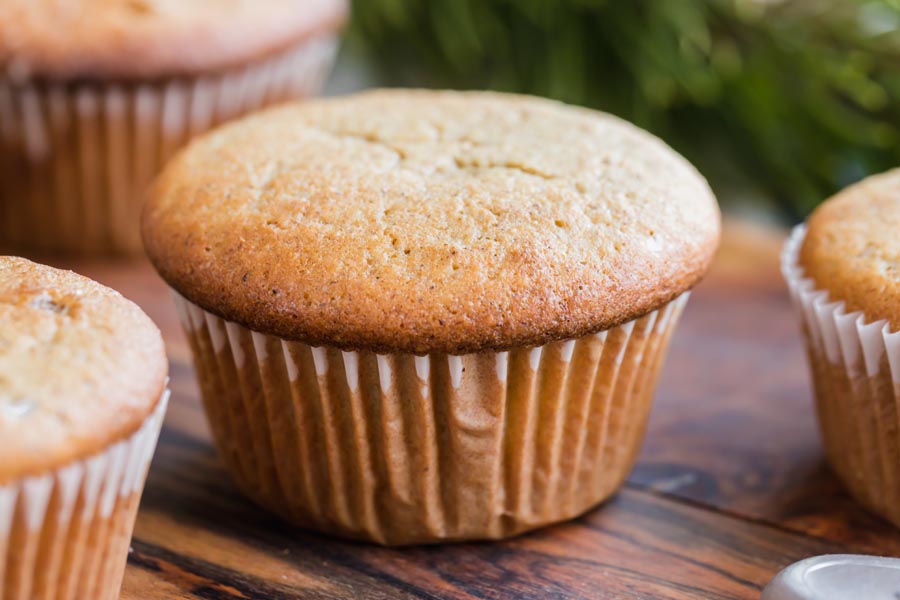 a puffy muffin with a white liner around it