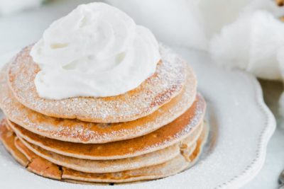 dollup of whipped cream on low carb gingerbread pancakes