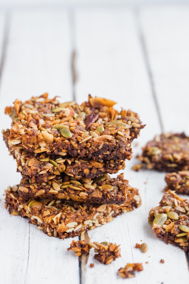 a stack of granola bars with chunks nearby