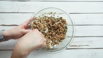 stirring granola bar mixture with a spoon