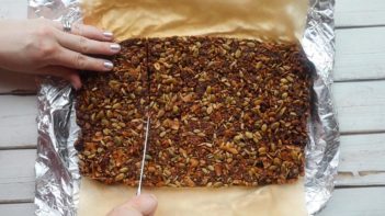 cutting into granola bars with a knife