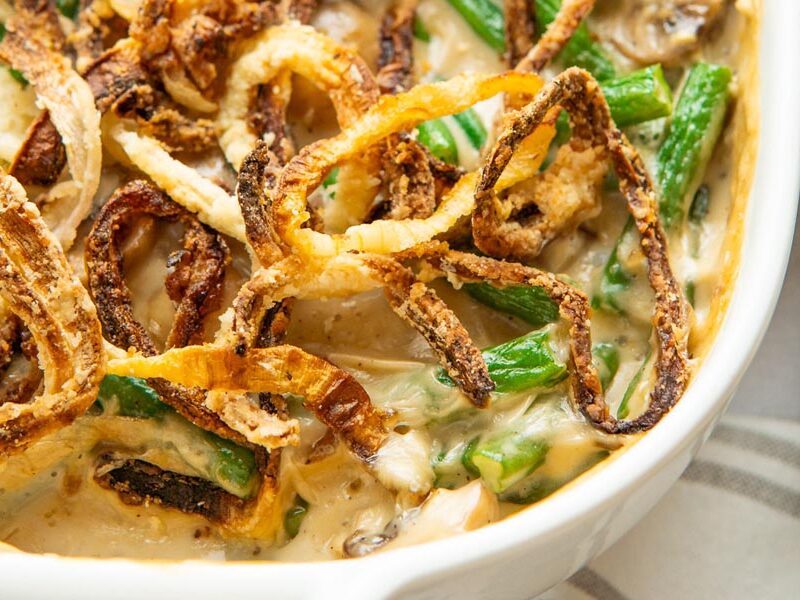 Close up of fried onions on top of green bean casserole.