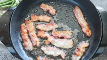 bacon cooking in a skillet