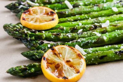 crispy grilled asparagus topped with lemons and cheese