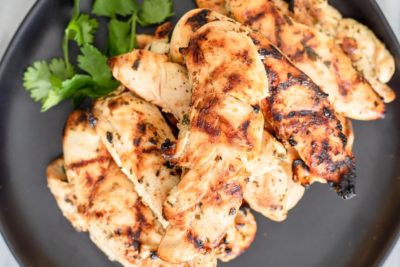 juicy chicken tenders on a plate with parsley