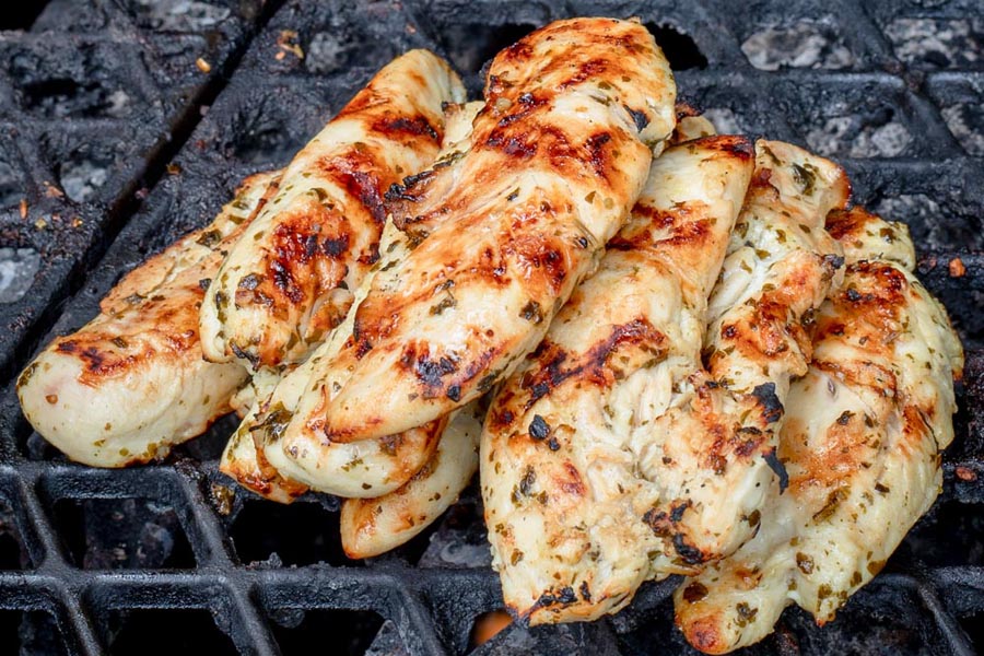 tenders stacked on each other on the grill