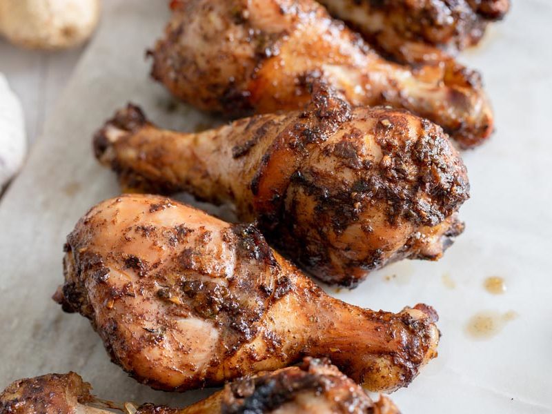 a bunch of grilled marinaded chicken legs