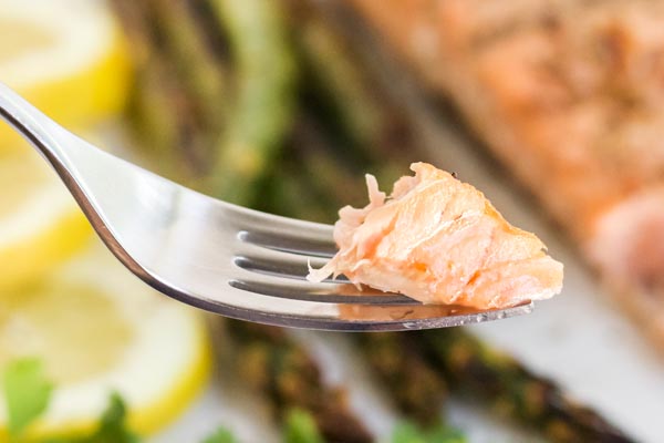 a bite of juicy salmon on a fork