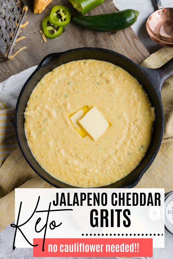 a skillet full of grits next to jalapenos and cheese
