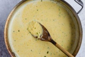 a wooden spoon on top of a skillet with lupin meal in it