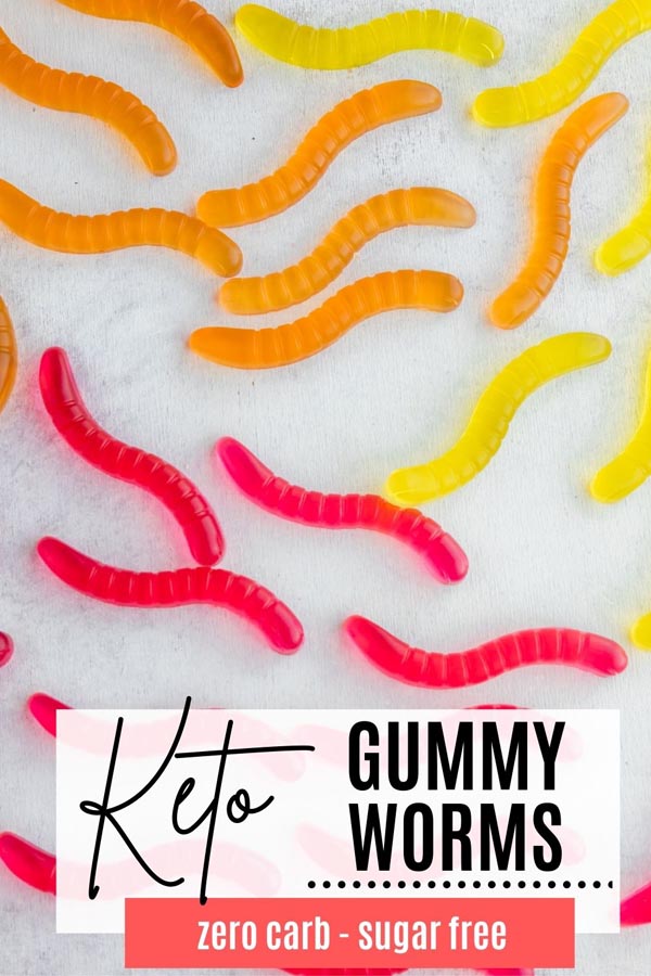 red, orange and yellow gummy worms on a table