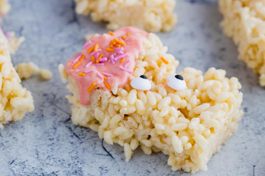 sticky keto rice krispie treat monster with pink hair and google eyes