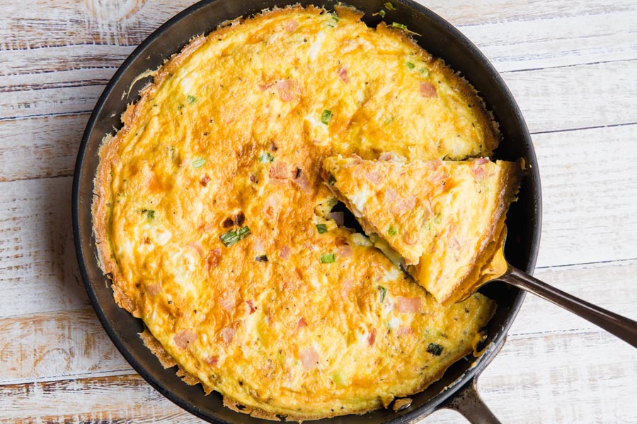 a slice of ham frittata on a skillet