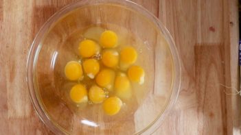 dozen eggs in a clear bowl