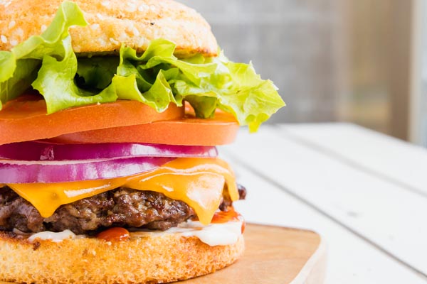 smashburger in between a SmartBun burger bun with all the burger fixings