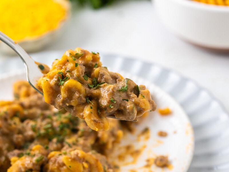 A bite of hamburger helper dinner on a fork.