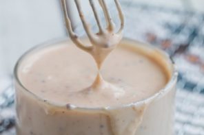 horseradish burger sauce dripping from a whisk
