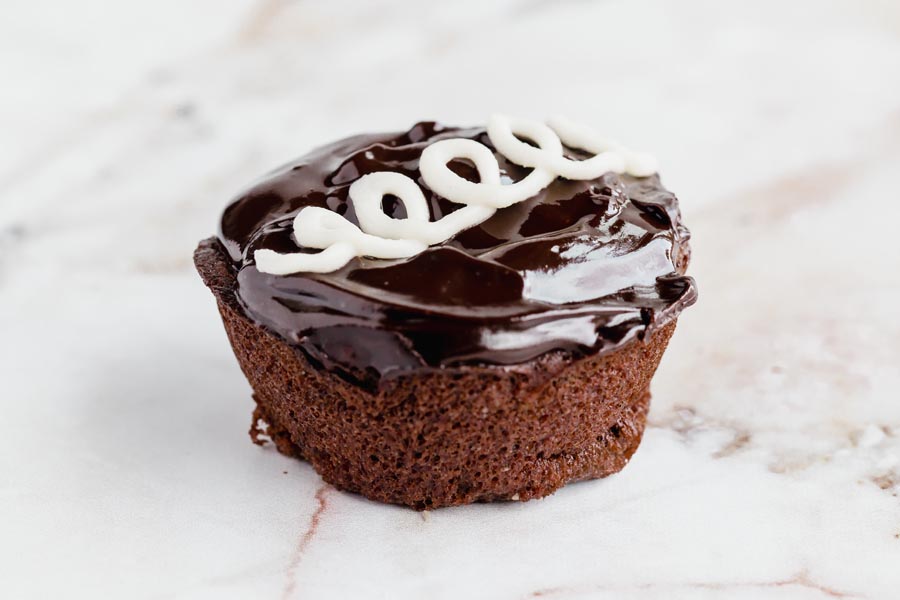 a close up of a chocolate frosted hostess cupcake copycat