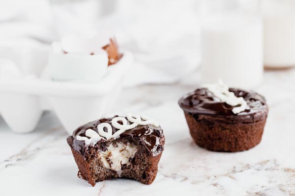 a bite out of a hostess cupcake to show the creamy center