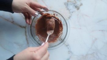 mixing chocolate batter with a fork