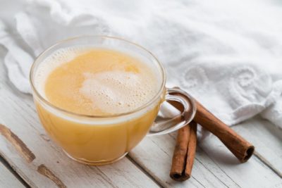 blended keto hot buttered rum with cinnamon sticks