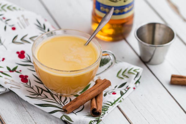 creamy hot buttered rum in a mug