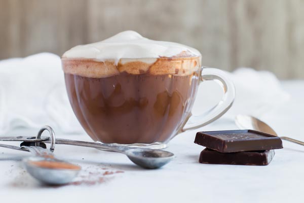 hot chocolate on table with different ingredients