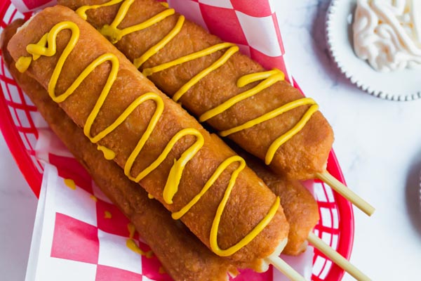 a basket full of keto corndogs