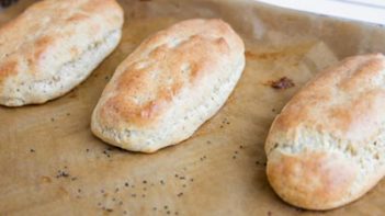 baked hot dog buns on a tray