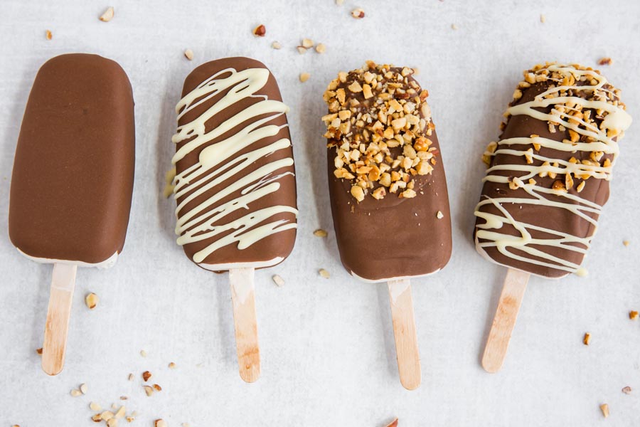 keto ice cream bars in a row with various toppings