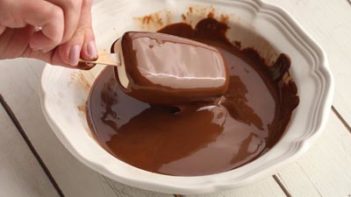 melted chocolate coating an ice cream bar