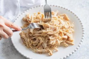 shredding chicken with two forks