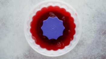 Red jello in a jello mold.