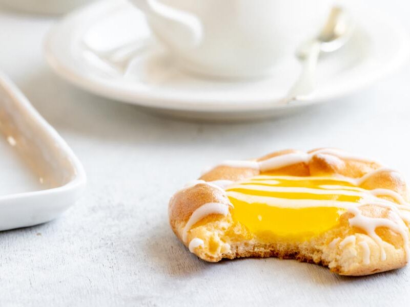 a bite taken out of a lemon filled danish