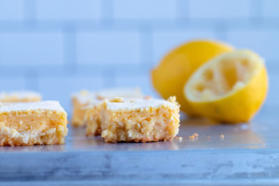 keto lemon bars dusted with powdered sweetener