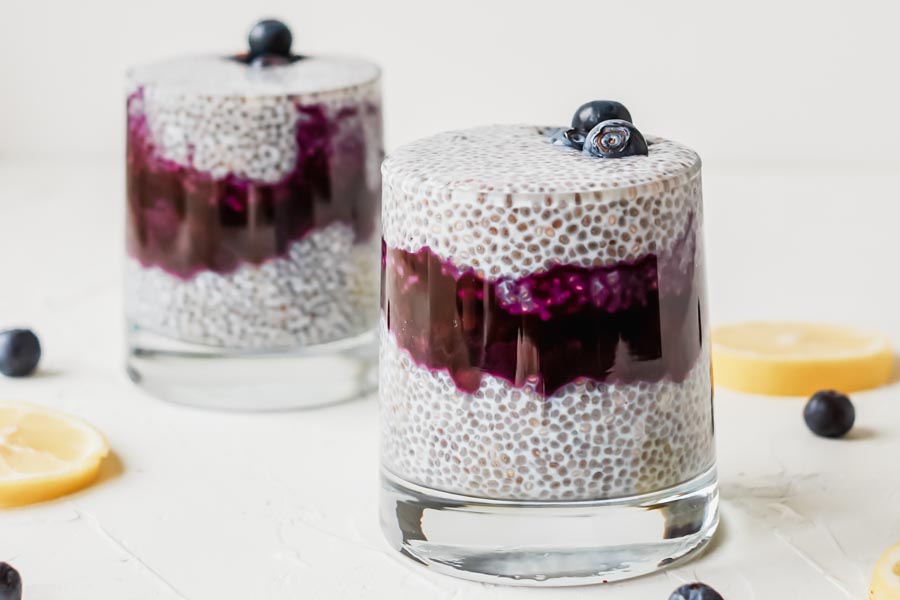 two glasses of layered chia pudding