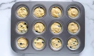 blueberrys in lemon muffin batter in a bowl