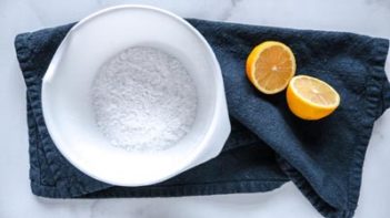 lemon muffin batter scooped into muffin tin